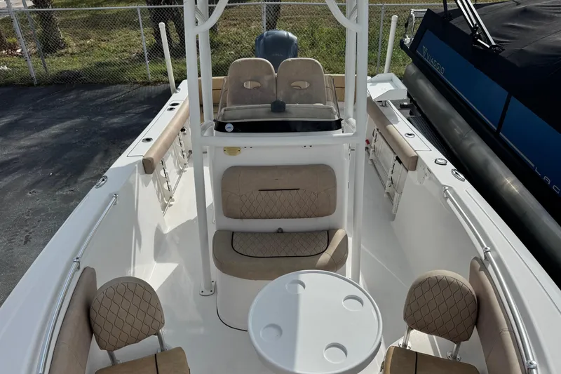 Slide: The Image of 2020 Sportsman Heritage 231 Center Console boat interior with seating and table. - 9