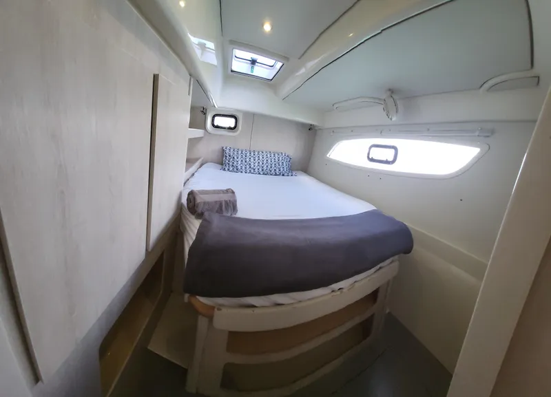 Slide: The Image of Interior of a 2016 Leopard 44 yacht, bedroom with bed and windows. - 23