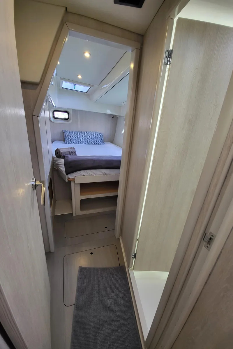 Slide: The Image of Interior of a 2016 Leopard 44 yacht featuring a cozy bedroom. - 27