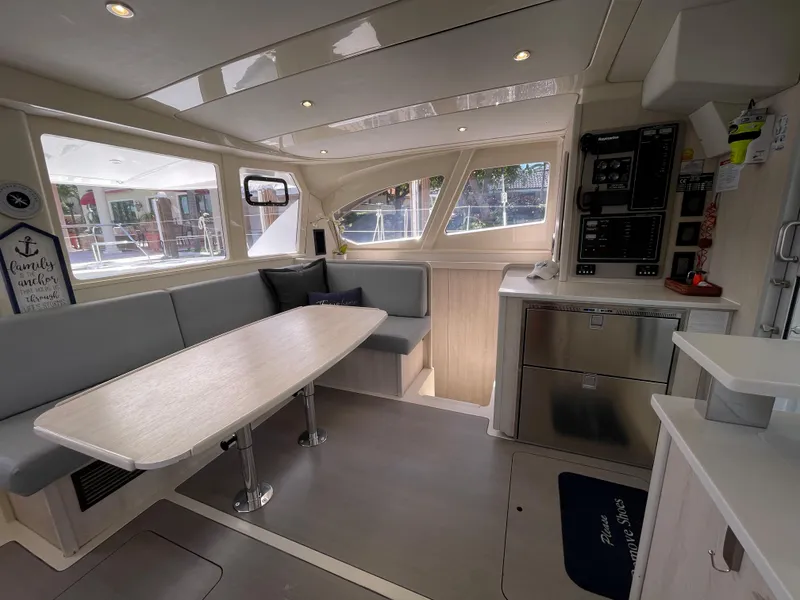 Slide: The Image of Interior of a 2016 Leopard 44 yacht with modern kitchen and dining area. - 30