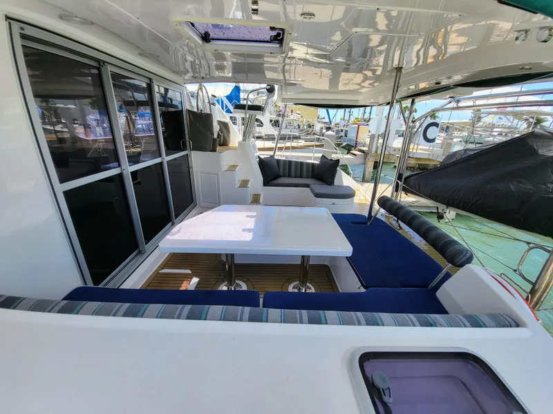 Slide: The Image of Leopard 44 catamaran 2016, spacious deck with seating area and table. - 4