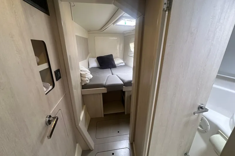 Slide: The Image of 2016 Leopard 44 yacht interior cabin with cozy bed and modern design. - 44
