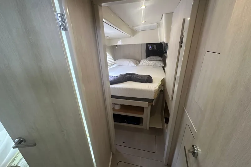 Slide: The Image of Interior cabin of a 2016 Leopard 44 yacht, featuring a cozy bed and modern design. - 45