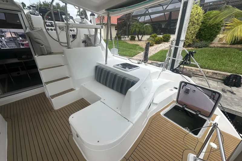 Slide: The Image of Leopard 44 catamaran cockpit with seating, helm, and open hatch, 2016 model. - 46