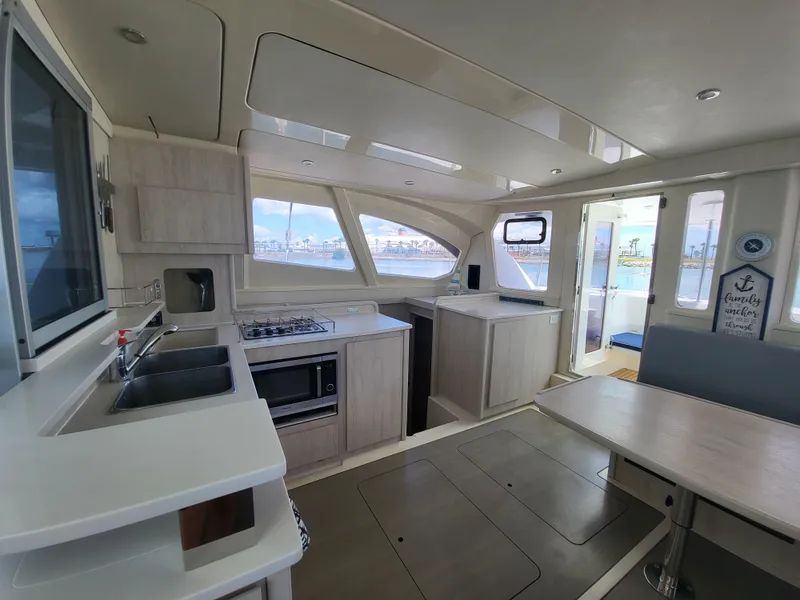 Slide: The Image of Interior of a 2016 Leopard 44 yacht with modern kitchen. - 6