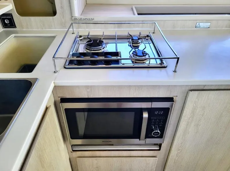 Slide: The Image of Leopard 44, 2016 kitchen with stove and microwave. - 9