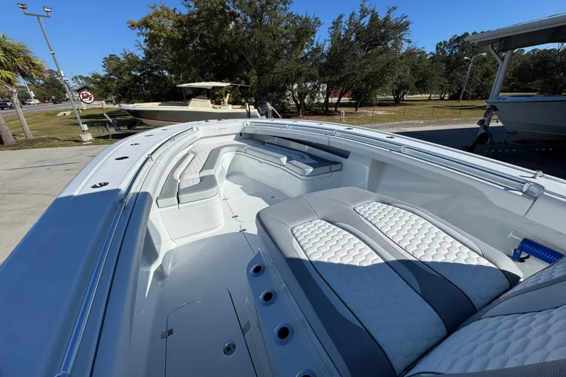 Slide: The Image of 2026 Yellowfin 36 Offshore boat interior with cushioned seating and sleek design. - 22