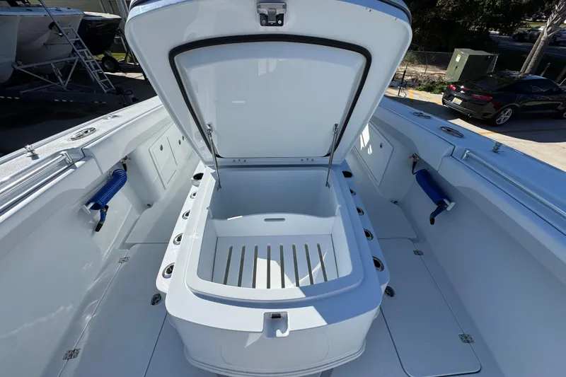 Slide: The Image of 2026 Yellowfin 36 Offshore boat with open storage compartment on deck. - 27