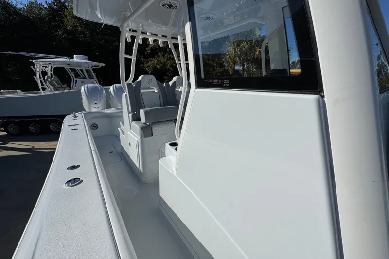 Slide: The Image of 2026 Yellowfin 36 Offshore boat, sleek design, spacious deck, modern seating, outdoor setting. - 29