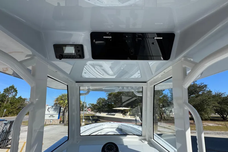 Slide: The Image of Interior view of 2026 Yellowfin 36 Offshore boat cockpit with navigation equipment. - 38