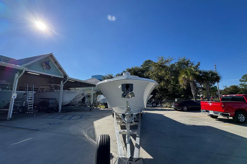 Slide: The Image of 2026 Yellowfin 36 Offshore boat on trailer under clear blue sky. - 7