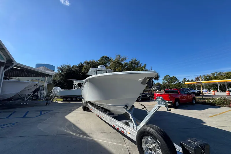 Slide: The Image of 2026 Yellowfin 36 Offshore boat on trailer in sunny outdoor setting. - 8