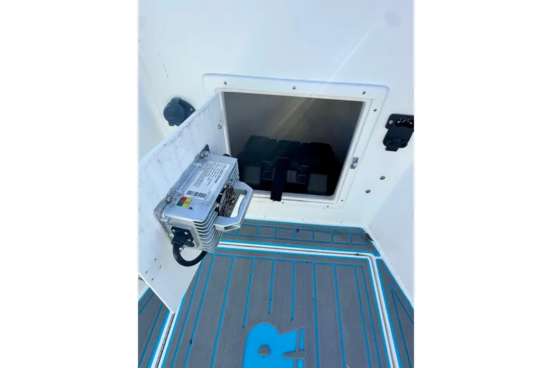 Slide: The Image of Open compartment on 2000 Contender 23 Open boat, showing interior equipment and deck. - 10