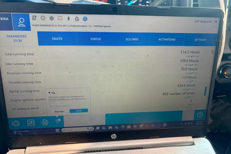 Slide: The Image of Laptop displaying engine diagnostics for Contender 23 Open, 2000 model, showing running times and settings. - 18