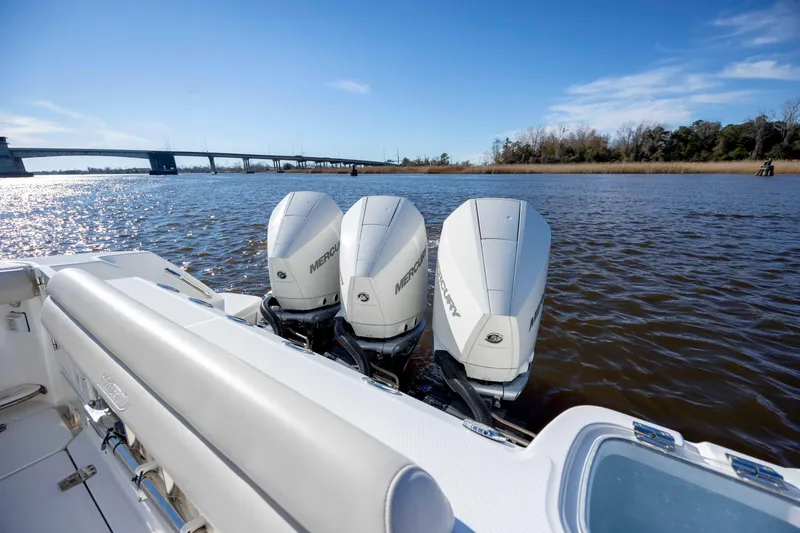 Slide: The Image of 2019 Boston Whaler 350 Outrage with triple Mercury engines on a sunny day. - 14