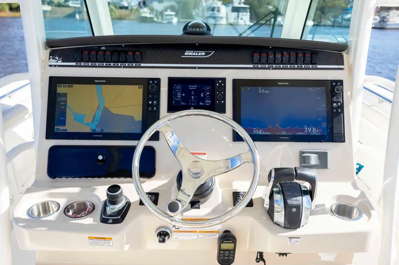 Slide: The Image of 2019 Boston Whaler 350 Outrage helm with advanced navigation displays and controls. - 21