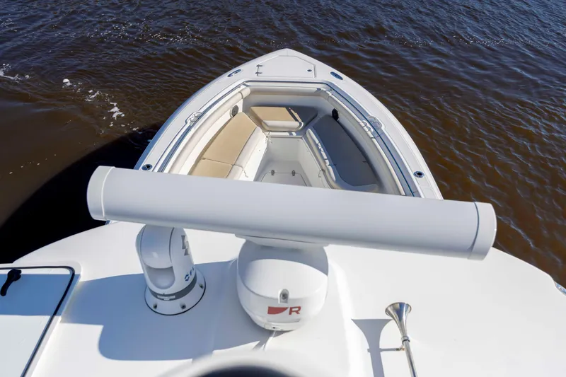 Slide: The Image of 2019 Boston Whaler 350 Outrage boat with spacious seating on calm water. - 32
