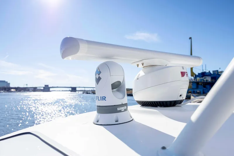 Slide: The Image of 2019 Boston Whaler 350 Outrage with advanced navigation equipment on a sunny day. - 34