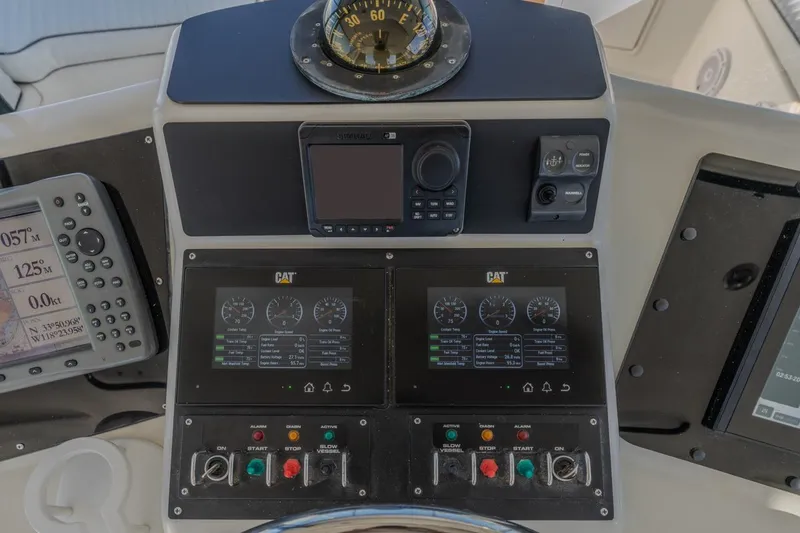 Slide: The Image of Control panel of a 1993 Ocean 65 Custom yacht with navigation instruments. - 14