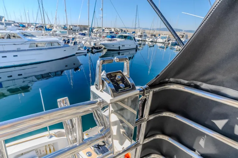 Slide: The Image of Control panel on a 1993 Ocean 65 Custom yacht in a marina setting. - 18