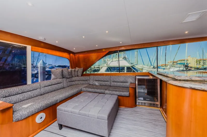 Slide: The Image of Luxurious interior of 1993 Ocean 65 Custom yacht with plush seating and marina view. - 21