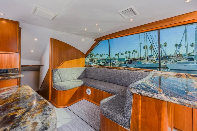 Slide: The Image of Luxurious 1993 Ocean 65 Custom yacht interior with marina view through large windows. - 22