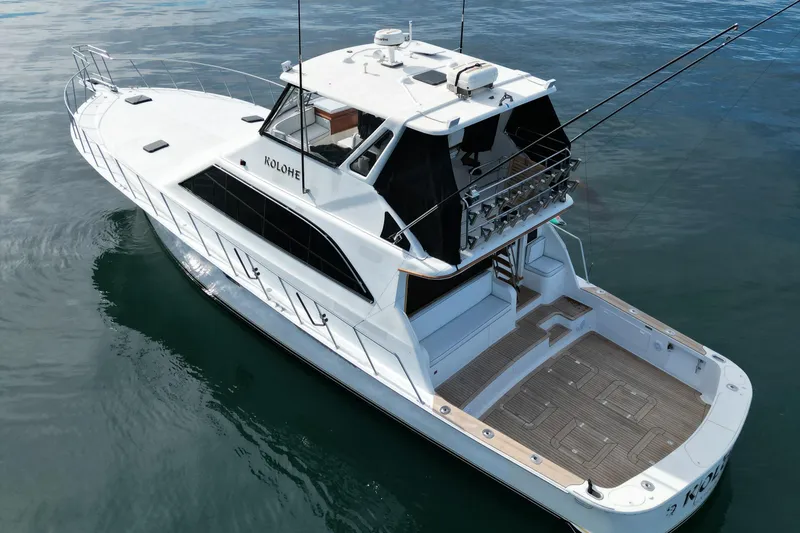 Slide: The Image of 1993 Ocean 65 Custom yacht on calm water, featuring spacious deck and sleek design. - 4