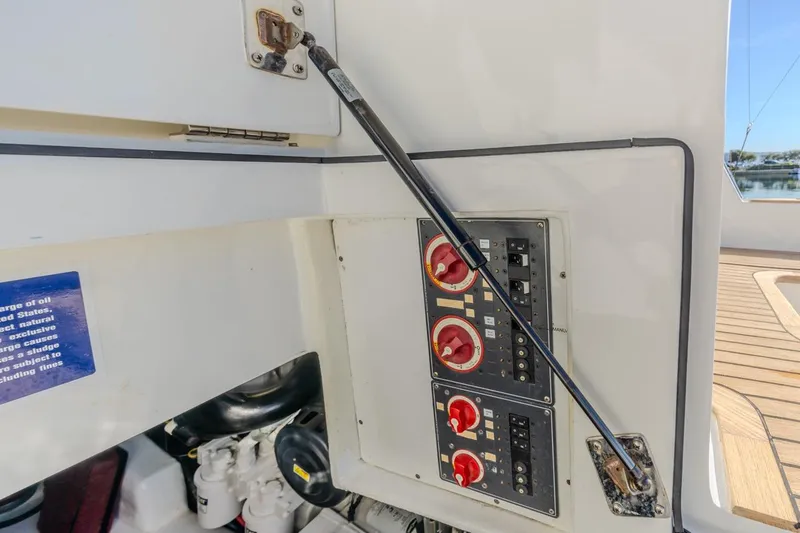 Slide: The Image of Control panel on a 1993 Ocean 65 Custom yacht, featuring switches and dials. - 43