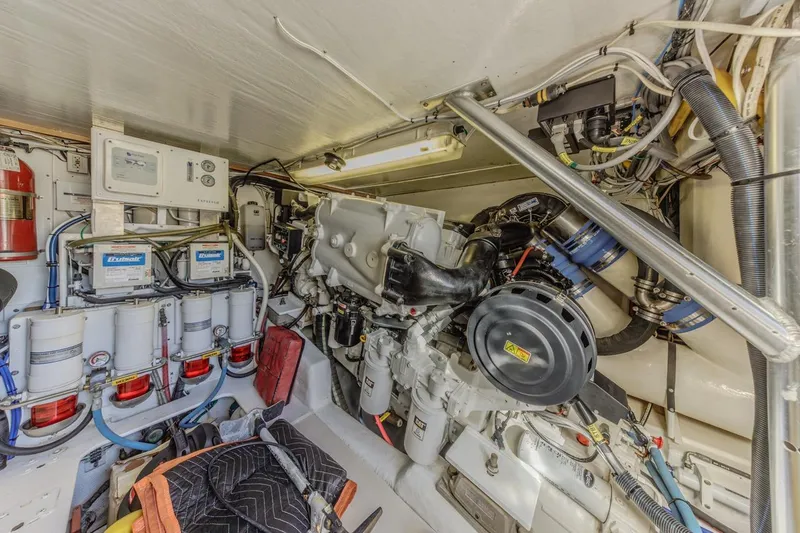 Slide: The Image of Engine room of 1993 Ocean 65 Custom yacht with mechanical components and wiring. - 45