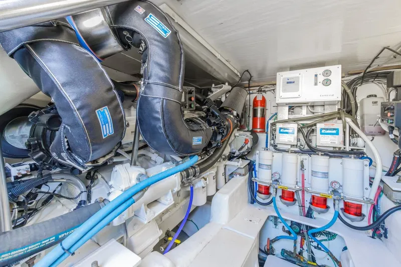 Slide: The Image of Engine room of a 1993 Ocean 65 Custom yacht, showcasing machinery and equipment. - 51