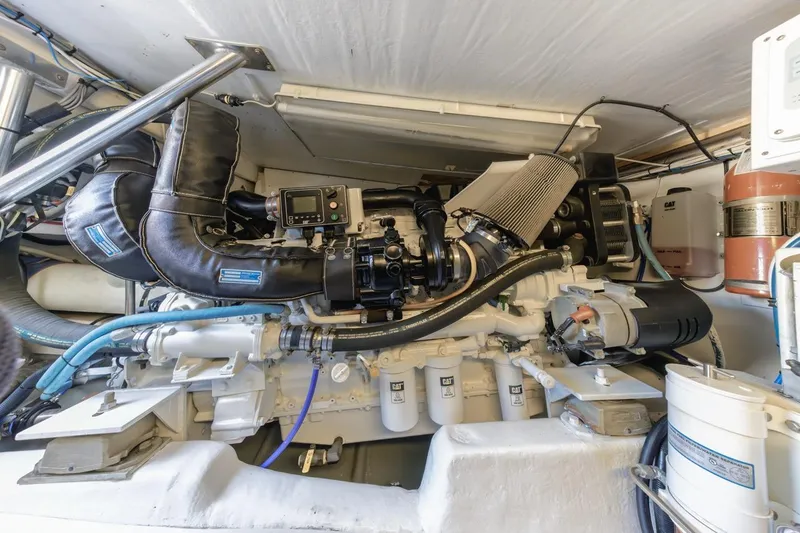 Slide: The Image of Engine room of a 1993 Ocean 65 Custom yacht, showcasing detailed machinery and components. - 53