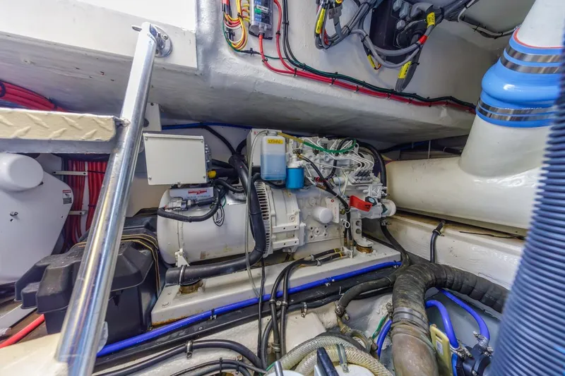 Slide: The Image of Engine room of a 1993 Ocean 65 Custom yacht, showcasing detailed wiring and components. - 54