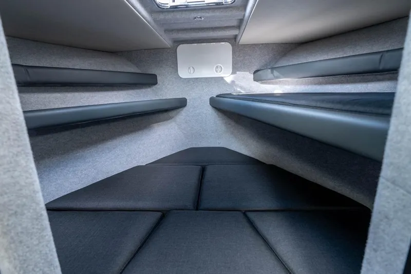 Slide: The Image of Interior cabin of 2025 Makaira Gen 3 36 boat with cushioned seating. - 10