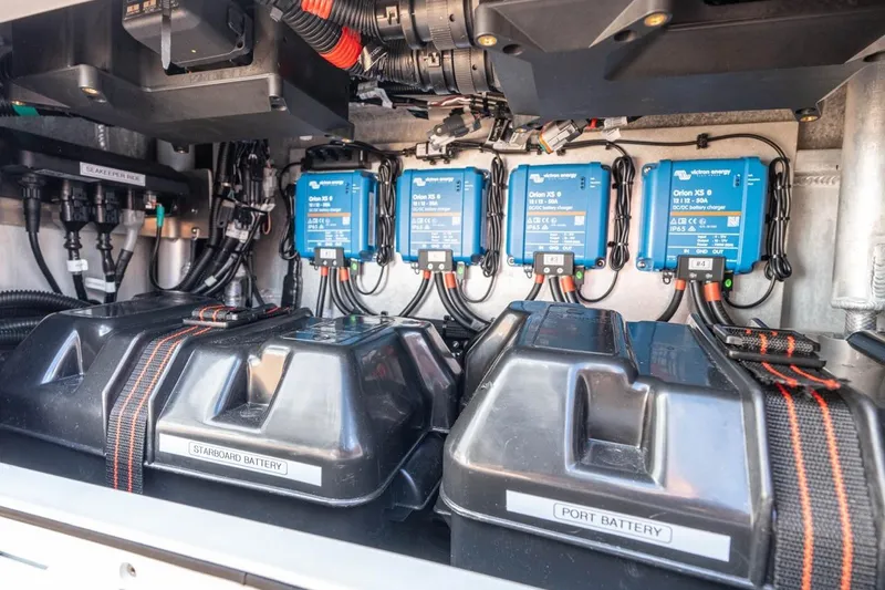 Slide: The Image of Electrical system of Makaira Gen 3 36, 2025 model, featuring batteries and chargers. - 17