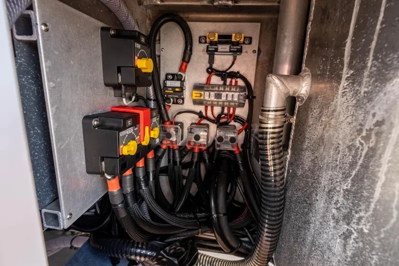 Slide: The Image of Electrical panel of Makaira Gen 3 36, 2025 model, showcasing wiring and circuit breakers. - 18