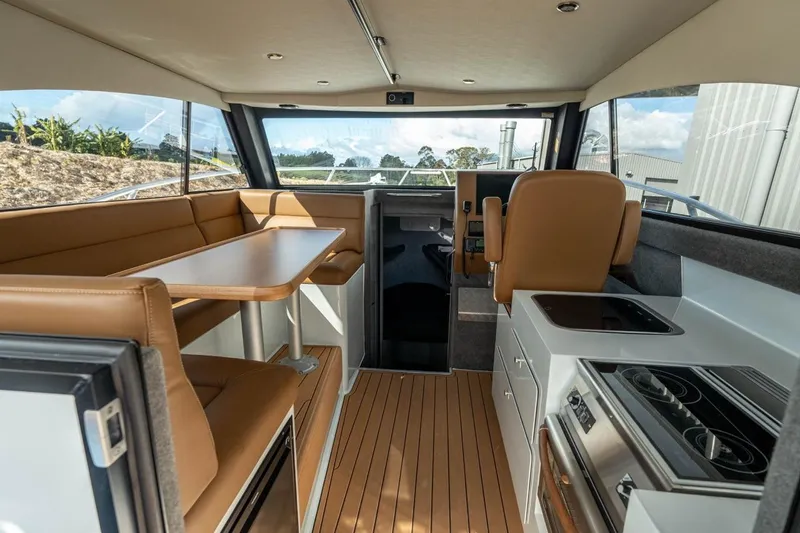 Slide: The Image of Interior of 2025 Makaira Gen 3 36 boat with modern seating and kitchen area. - 5