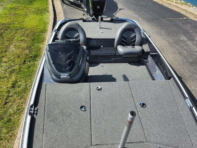 Slide: The Image of 2021 Nitro Z17 boat interior with gray seating and steering wheel. - 19