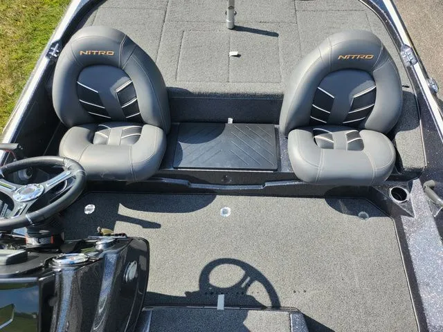 Slide: The Image of 2021 Nitro Z17 boat interior with gray seats and steering wheel. - 20