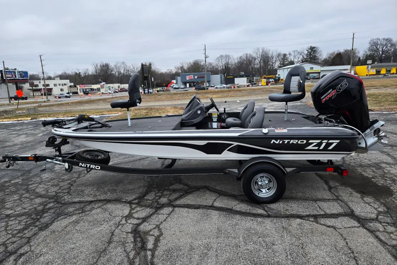 Slide: The Image of 2021 Nitro Z17 fishing boat on trailer, parked outdoors. - 25