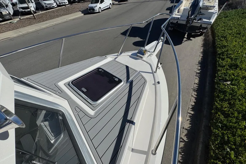 Slide: The Image of 2026 Defiance Admiral 250 EX boat deck with sleek design and modern features. - 100