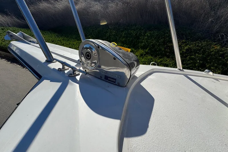 Slide: The Image of Bow of 2026 Defiance Admiral 250 EX boat with anchor winch. - 103