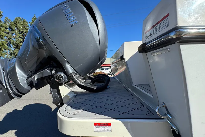 Slide: The Image of 2026 Defiance Admiral 250 EX boat with Yamaha outboard motor, rear view. - 25