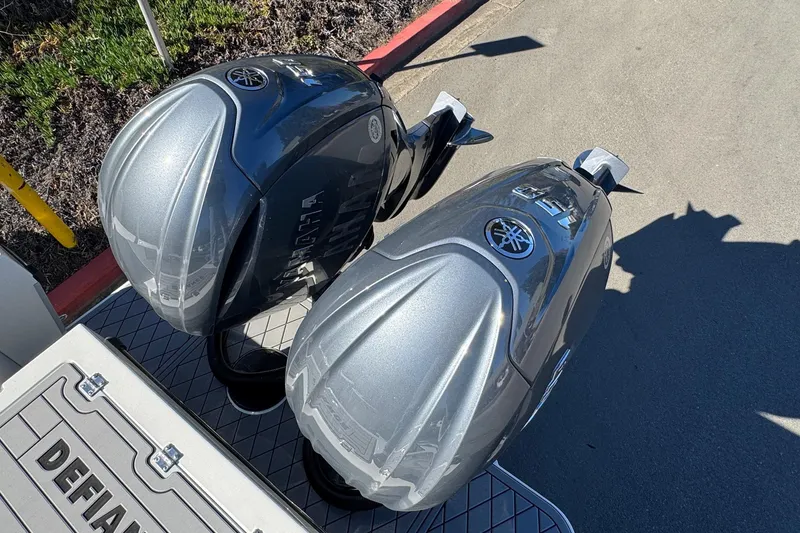 Slide: The Image of Twin Yamaha outboard motors on a 2026 Defiance Admiral 250 EX boat. - 27