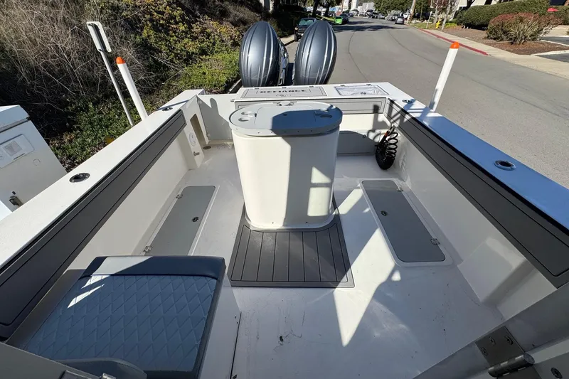 Slide: The Image of 2026 Defiance Admiral 250 EX boat interior with seating and storage compartments. - 36