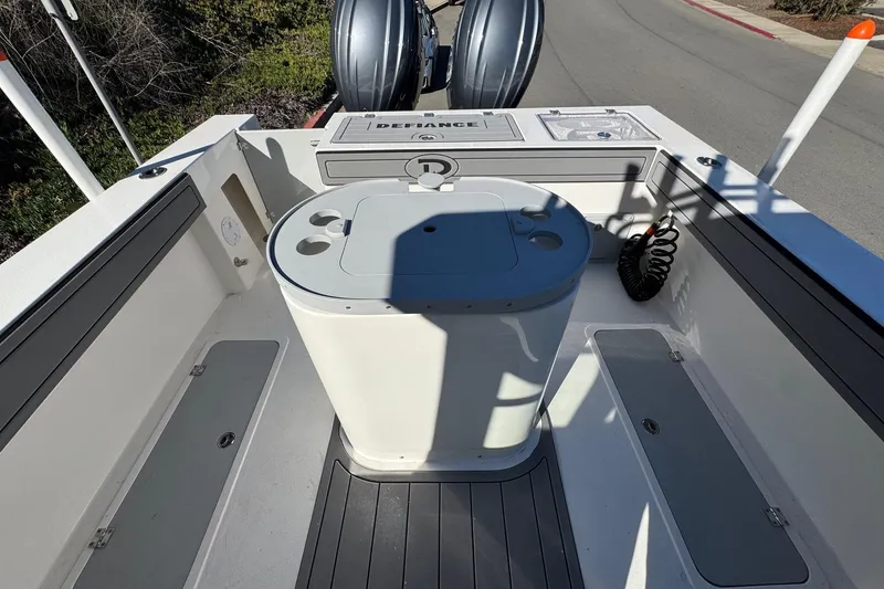 Slide: The Image of 2026 Defiance Admiral 250 EX boat interior with storage compartments and seating. - 39