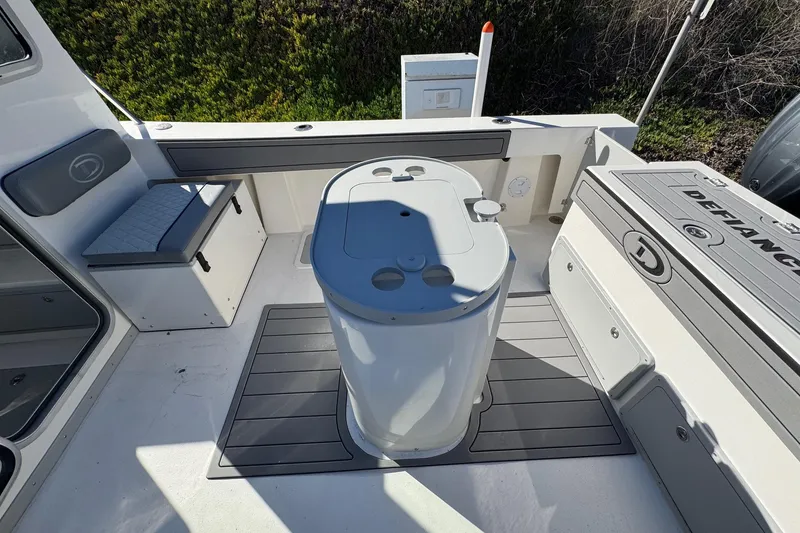 Slide: The Image of 2026 Defiance Admiral 250 EX boat interior with seating and storage compartments. - 40