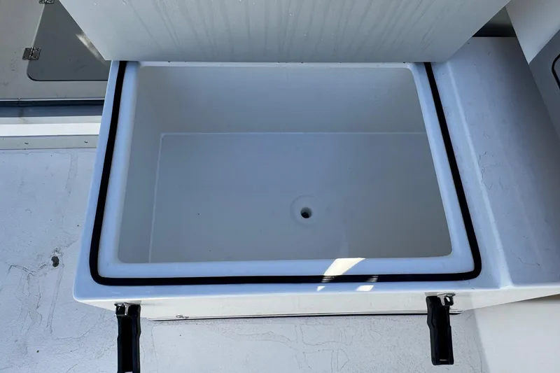 Slide: The Image of Open storage compartment on 2026 Defiance Admiral 250 EX boat. - 47