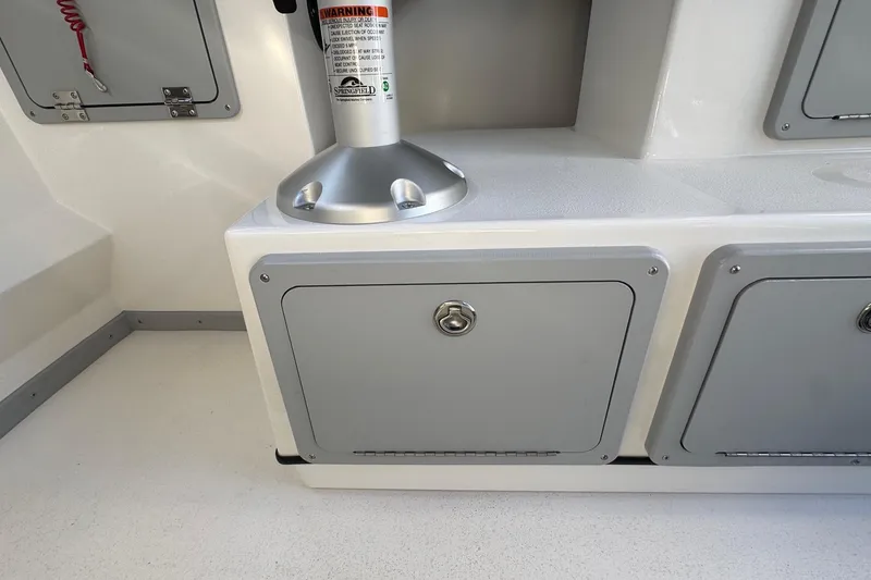 Slide: The Image of Interior of 2026 Defiance Admiral 250 EX boat with storage compartments. - 68