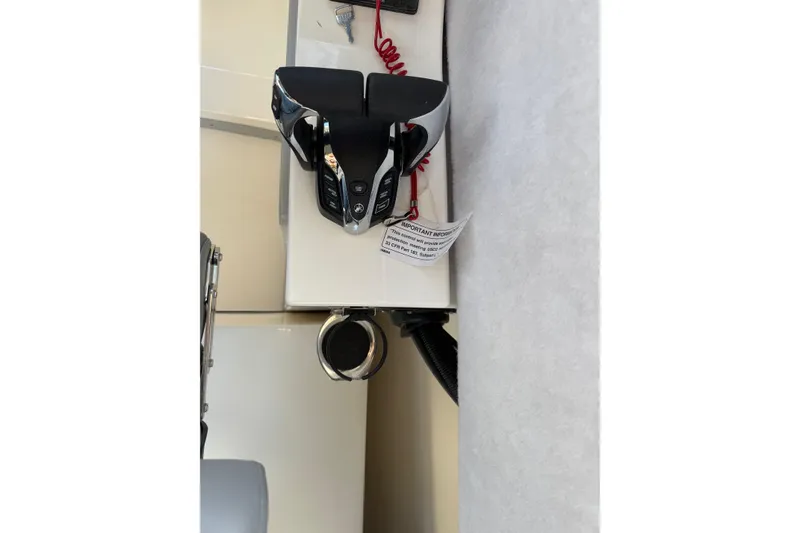 Slide: The Image of Control panel of 2026 Defiance Admiral 250 EX boat, featuring modern throttle controls. - 79