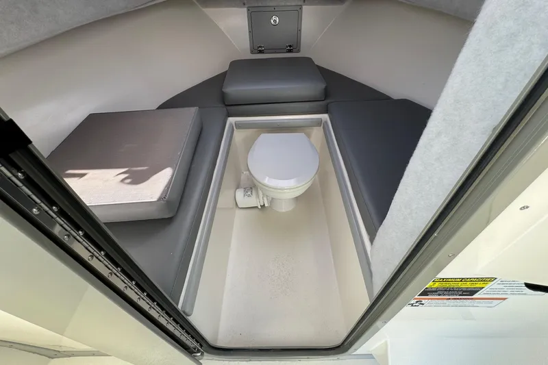 Slide: The Image of 2026 Defiance Admiral 250 EX cabin interior with toilet and cushioned seating. - 91
